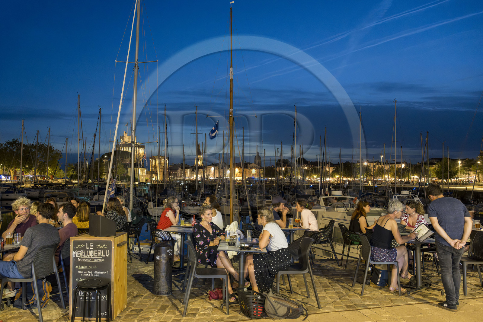 France, Charente Maritime, La Rochelle, the wet dock of the Old Port, terrace of the Merluberlu restaurant on the quays