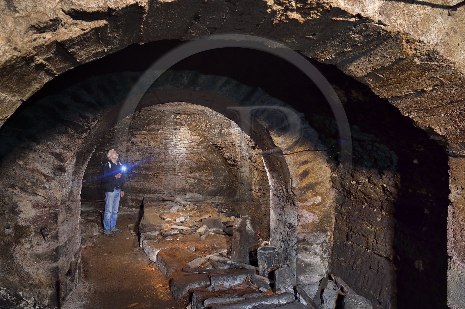France, Puy de Dome, Clermont Ferrand, René Ribeyre member of the ACAVIC association (Amis des Caves du Vieux Clermont) in the galleries dug in the basements in tuff of the Conservatory (former Lycée Blaise Pascal)