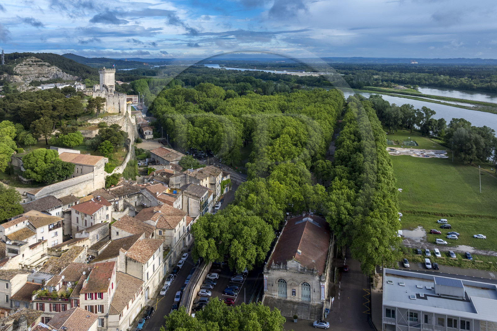 France, Gard, Beaucaire, Beaucaire Castle and the meadow which hosts the Madeleine Fair (Beaucaire Fair) on the banks of the Rhone (aerial view)