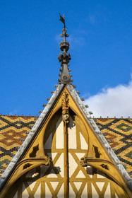 France, Cote d'Or, Beaune, area listed as World Heritage by UNESCO, Hospices de Beaune, Hotel Dieu, the roofs covered with glazed and colored tiles, dormer window detail