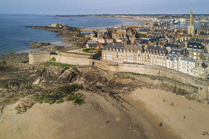 France, Ille et Vilaine, Cote d'Emeraude (Emerald Coast), Saint Malo, the walled city with the Bidouane Tower on the left and Bon Secours beach in the foreground (aerial view)