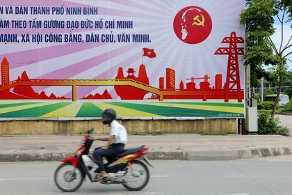 Vietnam, Ninh Binh, propaganda poster for the communist party