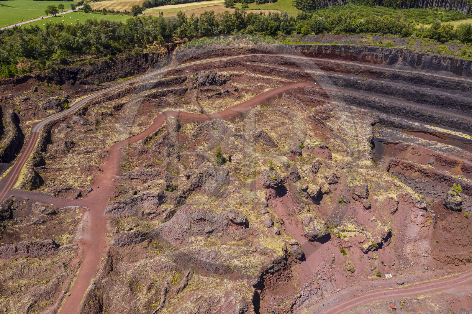 France, Puy de Dome, Parc Naturel Régional des Volcans d'Auvergne (regional nature park of Auvergne volcanoes), Chaine des Puys listed as World heritage by UNESCO, Saint Ours les Roches, Lemptegy volcano, a former pozzolan quarry that has become an educational site open to the public (aerial view)