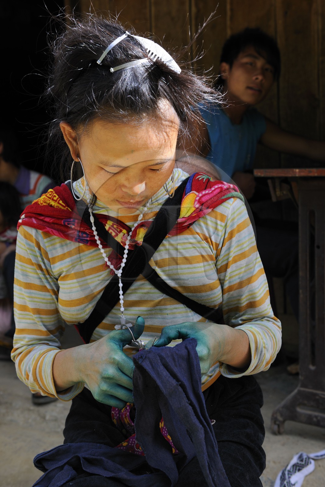 Vietnam, Lao Cai province, Sapa district, the Black Hmong minority group, sewing and blue indigo dyeing work