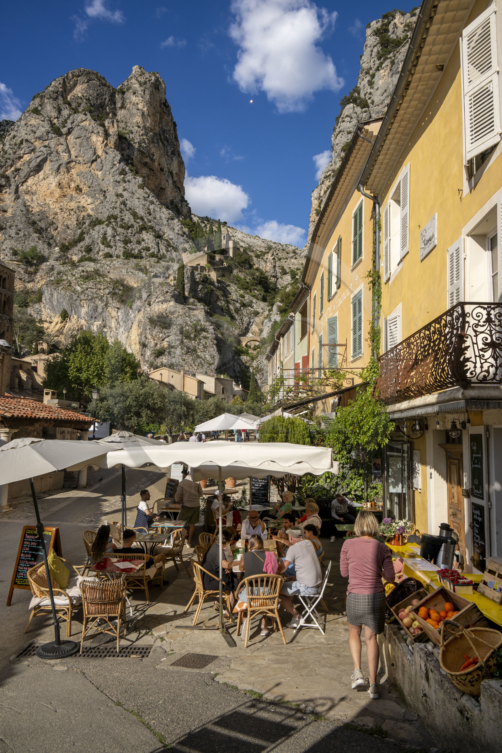 France, Alpes de Haute Provence, Parc Naturel Régional du Verdon, village of Moustiers Sainte Marie, labelled Les Plus Beaux Villages de France (The Most Beautiful Villages of France), the Star of Moustier hanging on a chain several tens of meters above the ground and the Notre-Dame de Beauvoir chapel in the background in the cliff