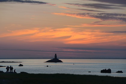 France, Finistere, La Foret Fouesnant, Glenan islands, St Nicolas Island, sunset on the west coast and the former Huic lighthouse now abandoned