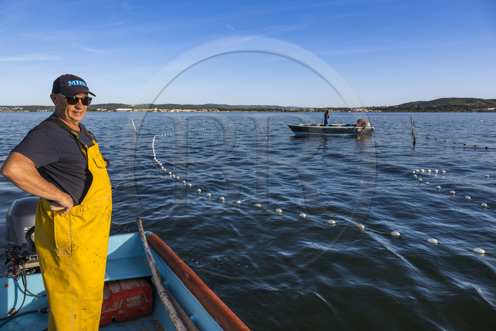France, Herault, Sete, la Pointe Courte district, the fisherman Robert Rumeau lifts his nets on the Etang de Thau