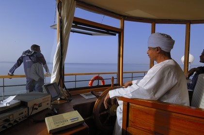 Egypt, Upper Egypt, Nubia, Lake Nasser, lake cruise on Qasr Ibrim ship, the cockpit and the captain