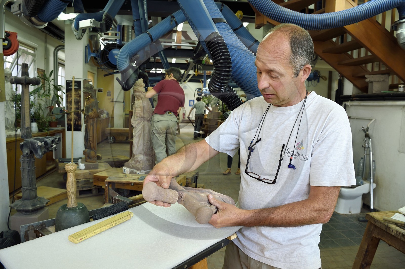 France, Bas Rhin, Strasbourg, old town listed as World Heritage by UNESCO, sculpture and stonemasons' workshops of the Oeuvre Notre-Dame Foundation, dowel assembly between two pieces of sandstone