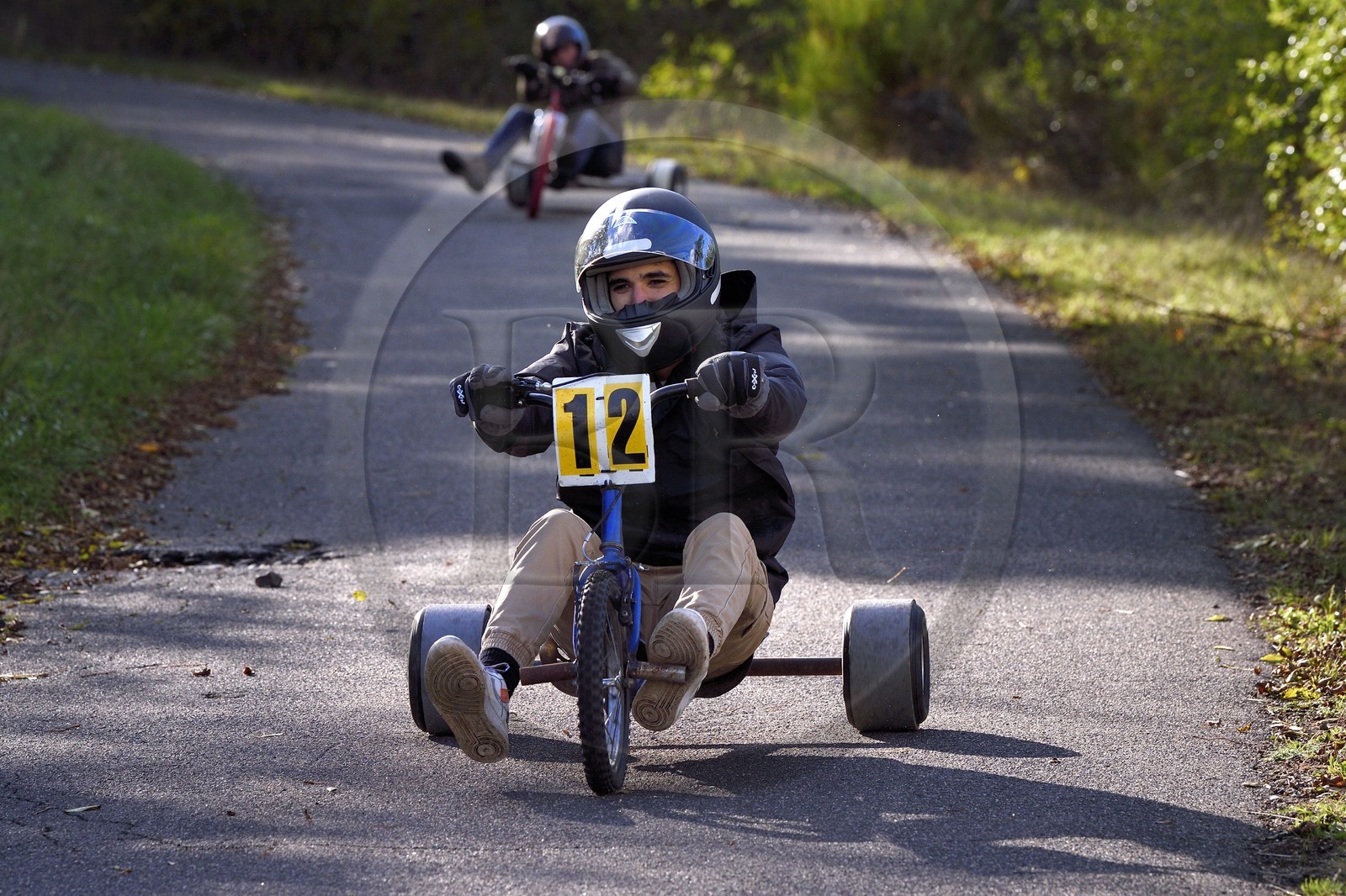 France, Haute Loire, Polignac, Drift Trike, skidding a tricycle down a hill