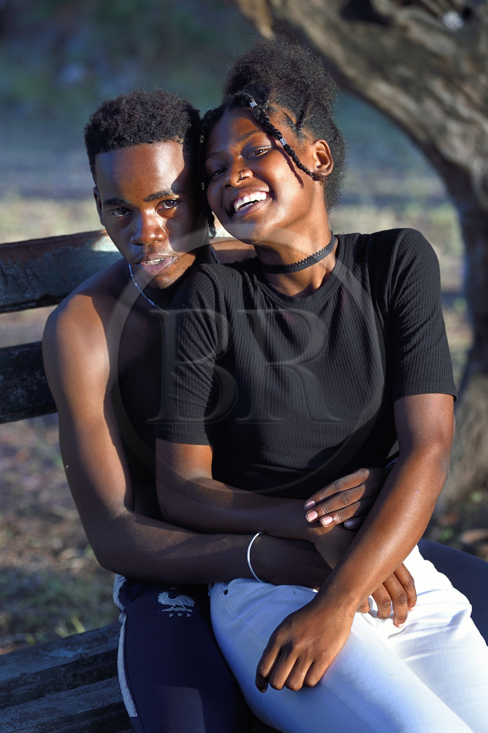 France, Mayotte island (French overseas department), Petite-Terre, Dzaoudzi, teens in discussion