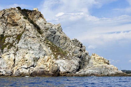 France, Var, Six Fours les Plages, Ile des Embiez, Pointe du Coucoussa overlooked by the Tour de la Marine, Freestyle windsurfing champion Adrien Bosson on a paddle boarding excursion
